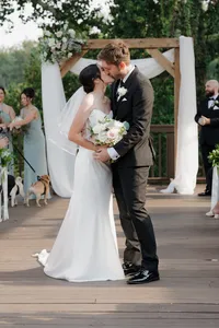 wedding couple kissing after getting married at ivy hall in roswell
