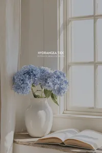 Hydrangea Tide submark logo from the coastal brand kit template displayed with a white vase of blue hydrangeas