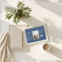 iPad mockup of the Coastal Dream one-page website template resting on a wooden outdoor table