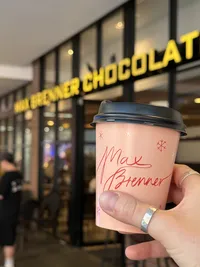 CRC brands owner, Chloe holding Max Brenner Christmas Cup Branding Design