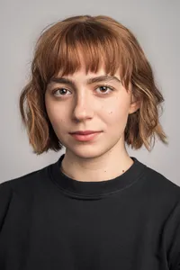 Actor headshot of a woman with confident expression, rembrandt lighting, neutral background