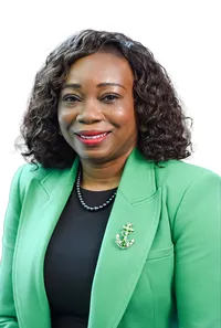 Headshot of a banking executive with confident expression, neutral studio background