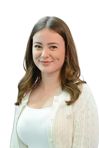 Professional portrait of a financial professional with subtle smile, studio lighting