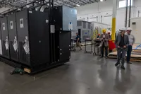 People walking around a warehouse