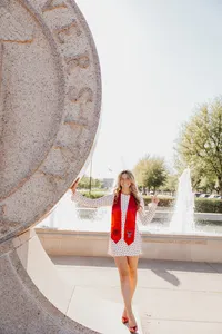 A TTU grad posed on campus in Lubbock Texas