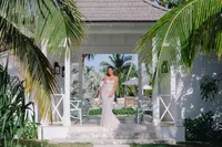 Bride and groom walking down the aisle after their oceanfront wedding ceremony at The Potlatch Club in Eleuthera, Bahamas