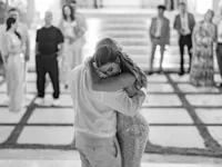 Joyful bride and groom first dance at luxury beach wedding ceremony at The Potlatch Club in Eleuthera Bahamas
