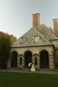 Couple dancing in front of a mansion in Newport, Rhode Island