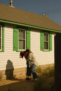 Couple hugging near homes in Cape Cod, Massachusetts.