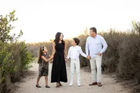 family holding hands during a family photo session in Orange County