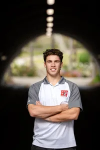 High school senior smiling during a graduation photo session in Orange County