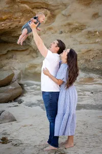 Parents and baby during an outdoor family photography session in Orange County
