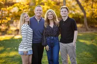 Parents and teens embracing during a family photography session in Orange County