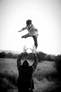 Father and children playing during a family photography session in Orange County