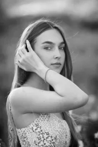 Senior girl looking at the camera during a graduation photo session in Orange County