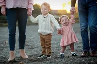 baby and kid smiling during a family photography session in Orange County