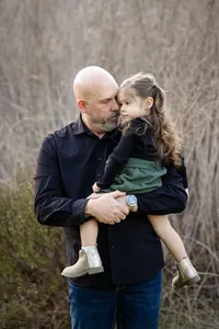 Father and daughter embracing during a family photography session in Orange County