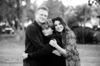 parents and son hugging during a family photo session in Orange County
