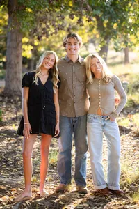 Siblings embracing during a family photography session in Orange County