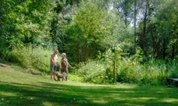 Older couple enjoying the countryside views from the grounds of the Fox & Hounds Country Hotel in Devon.