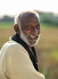 Environmental portrait of a man photographed during Simon Moore's travels in India.
