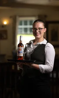 fox-and-hounds-waitress-serving-wine-simon-moore