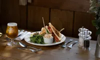 Club sandwich served with salad and fries at the Fox & Hounds Country Hotel.