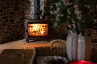 Hunter Stoves Aspect 7 wood-burning stove in a warmly styled autumnal interior.