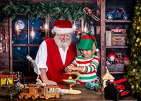 Child dressed as a Christmas elf spins a magical toy beside Santa during a Santa's Workshop photography session in Jacksonville, Florida with Nature's Child Photography, surrounded by handmade wooden toys, festive workshop details, and glowing North Pole magic.