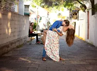 St. Augustine, couples capturing two partners wrapped in the moment, laughing and dancing freely to the beat of a street performer’s drum in the heart of the Old City. (Photographed by Nature's Child Photography)