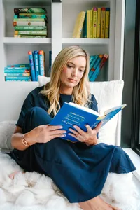sasha reading a book in a dress