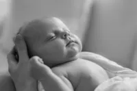 sleeping-newborn-portrait-parent-hands-black-white-boulder-in-home-photographer-146-B&W
