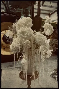 Locally grown wedding flowers displayed on a vintage tractor at a Nebraska flower farm.