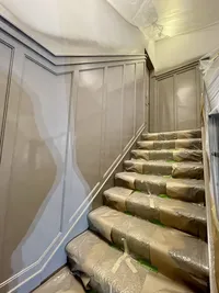 Wayzata board and batten stair painting with gray colors by Maple Grove interior painter.