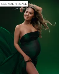 Dark green maternity gown with a strapless neckline, fitted silhouette, gathered fabric, and high leg opening.