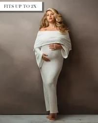 Off the shoulder white maternity dress with a layer of folded fabric over the bust and long belle sleeves.