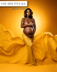 Yellow maternity skirt worn below the belly, with a fitted silhouette and wide fabric flowing to both sides.
