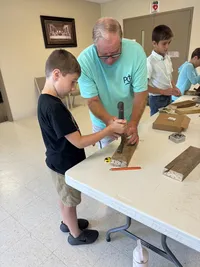 kid in carpentry class on life skills day