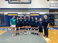 girls volleyball team and coaches