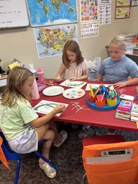 Kids painting during art class