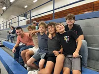 Pathway boys supporting at girls volleyball game