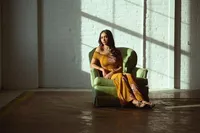 Senior girl photographed in a gown with high-fashion studio lighting