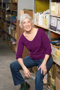 On-location business headshot in urban Minneapolis setting with industrial backdrop and editorial styling