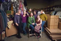 Creative professionals photographed together during on site corporate headshot session in Minneapolis warehouse studio