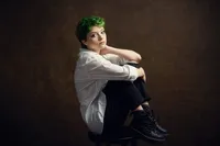 Studio senior portrait with seamless backdrop and editorial lighting by St. Paul photographer