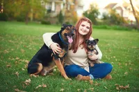 Senior Picture Photographer Captures Joyful Teen with Beloved Dogs Outdoors-03