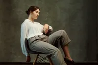 High school senior photographed in boutique portrait studio near Minneapolis with full glam styling