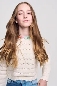 Commercial modeling headshot with warm approachable smile