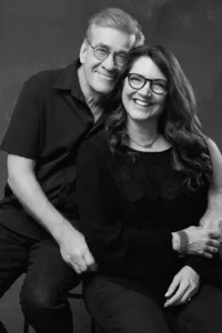 Painterly fine art family portrait with dramatic studio lighting