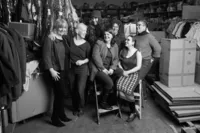 Professional team photographed together during on site business headshot session in St Paul Minnesota
